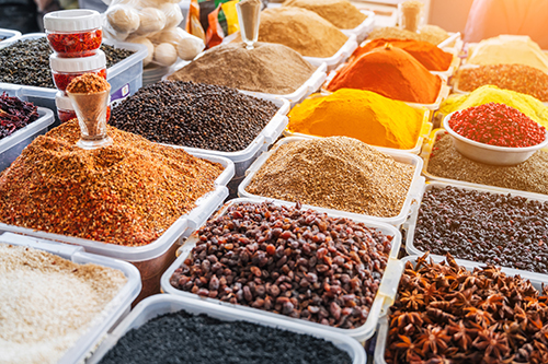 Assortment of various oriental spices on the counter at the Asian bazaar in close-up
